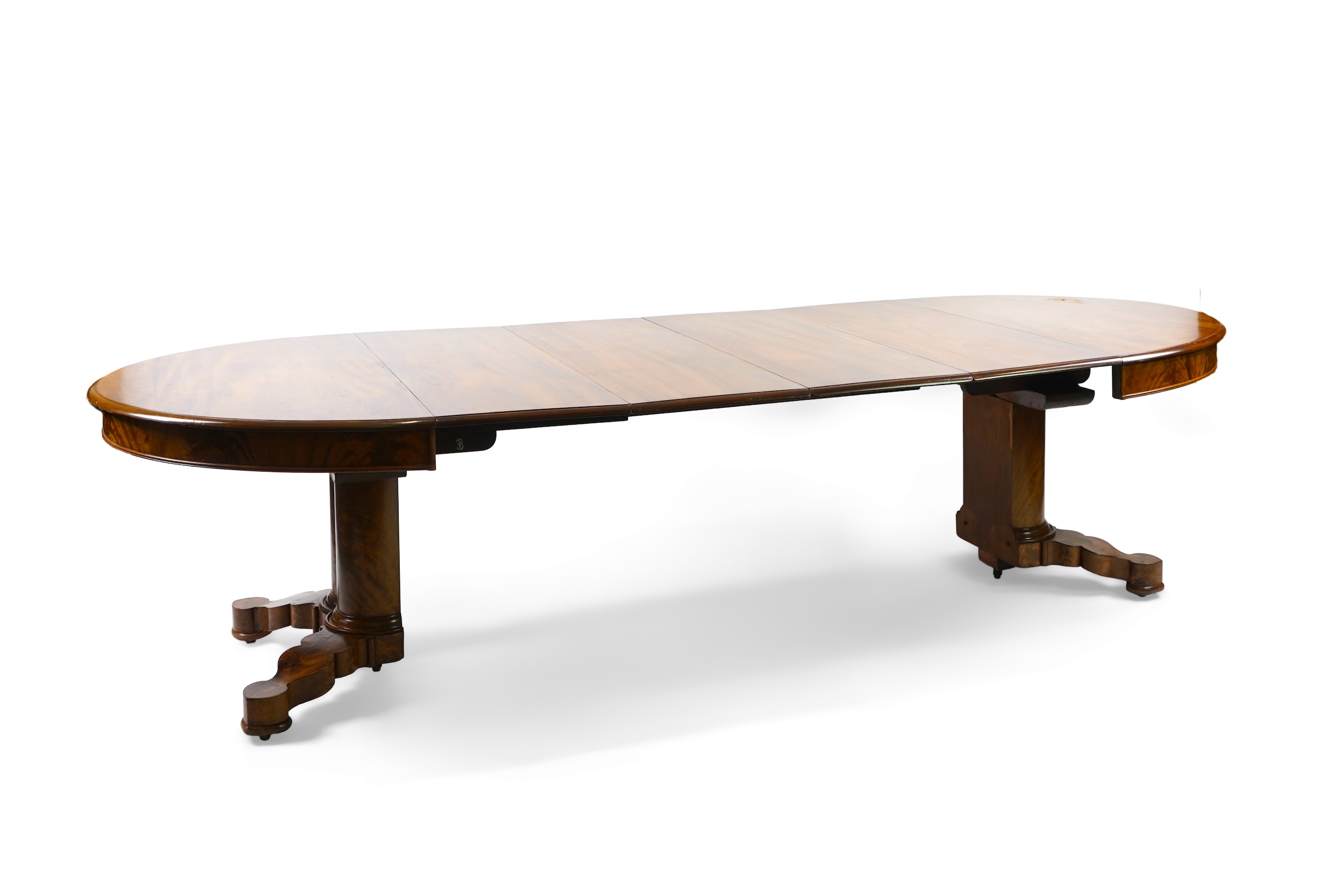 A mid 19th century Continental mahogany extending dining table